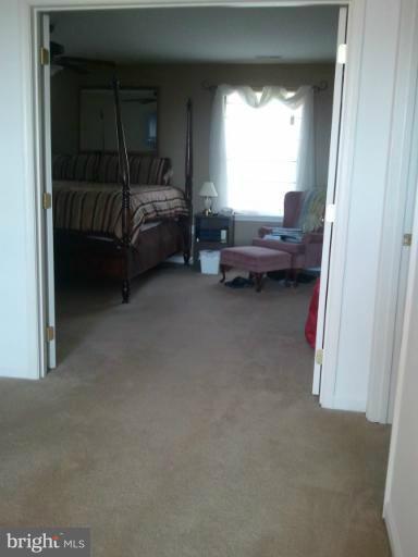 84 Boise Road Inwood, WV 25428 - Photo 8 of 30 a bed room with a bed and a window