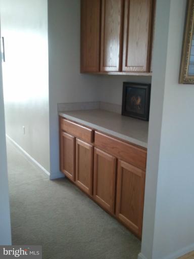84 Boise Road Inwood, WV 25428 - Photo 9 of 30 a kitchen with granite countertop white cabinets and a stove