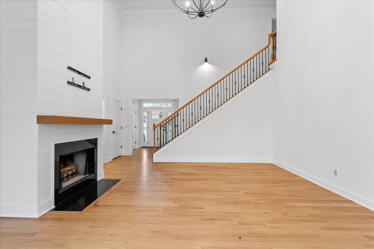 5004 Paint Creek Court Spring Hill, TN 37174 - Photo 12 of 91 a view of empty room with wooden floor and fireplace