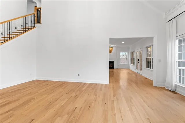 a kitchen with granite countertop a sink a stove and cabinets