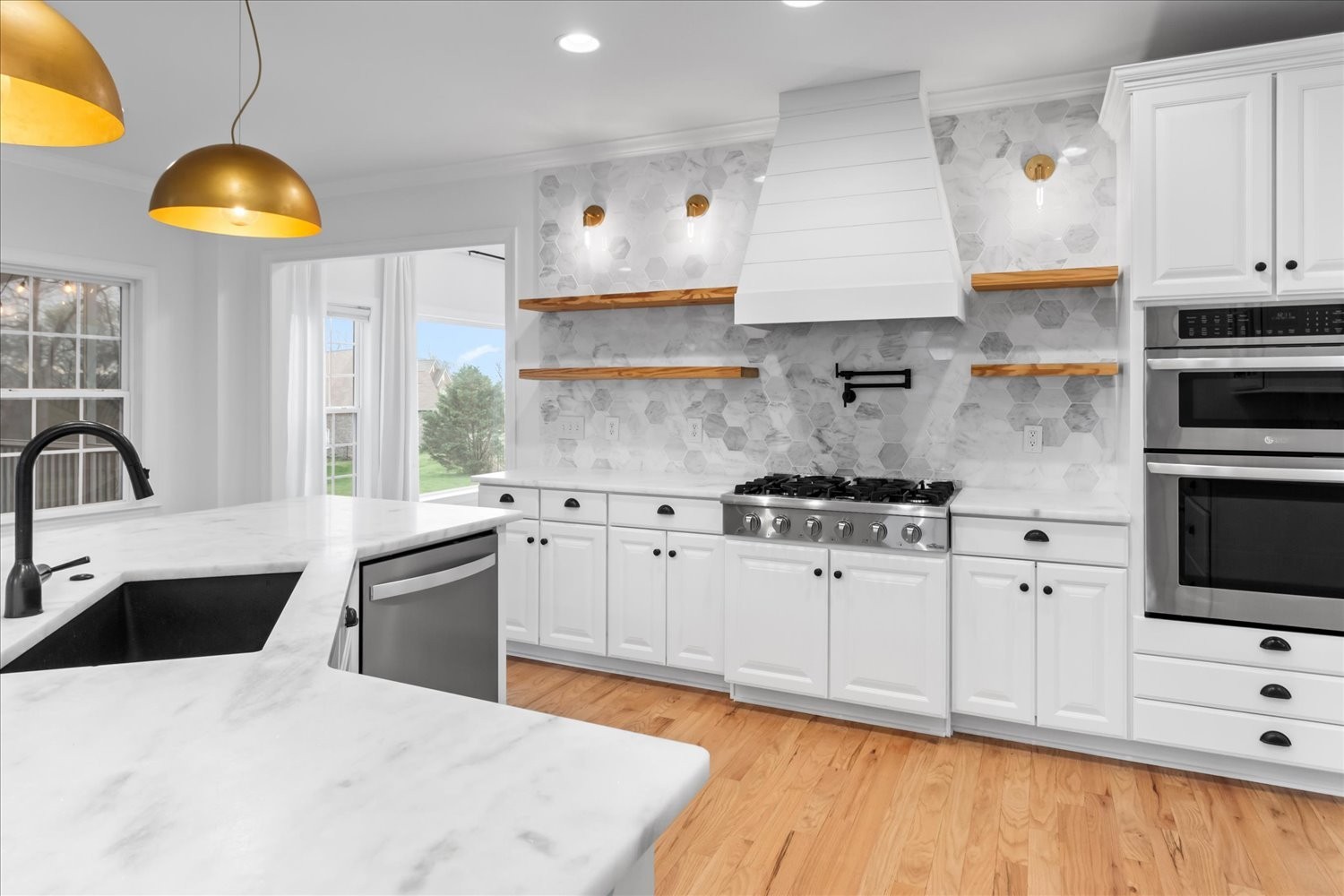 5004 Paint Creek Court Spring Hill, TN 37174 - Photo 20 of 91 a kitchen with granite countertop a sink a stove and cabinets