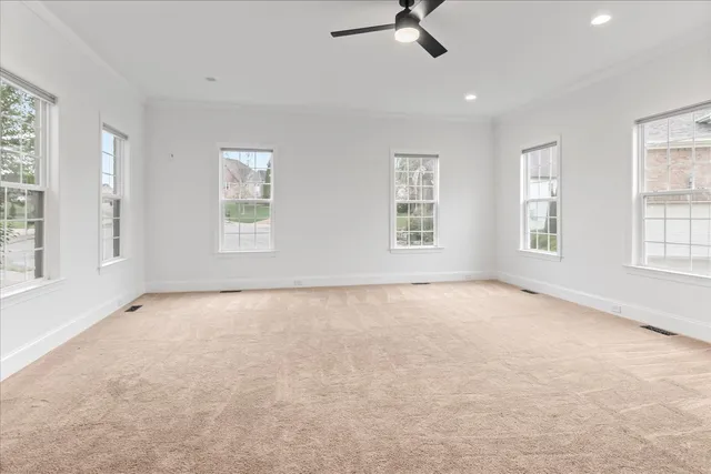 a bathroom with a granite countertop sink a toilet and a mirror