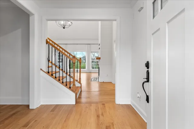 a view of a livingroom with wooden floor and a window