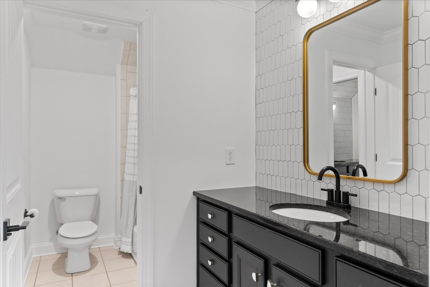 5004 Paint Creek Court Spring Hill, TN 37174 - Photo 54 of 91 a bathroom with a granite countertop sink a toilet and a mirror