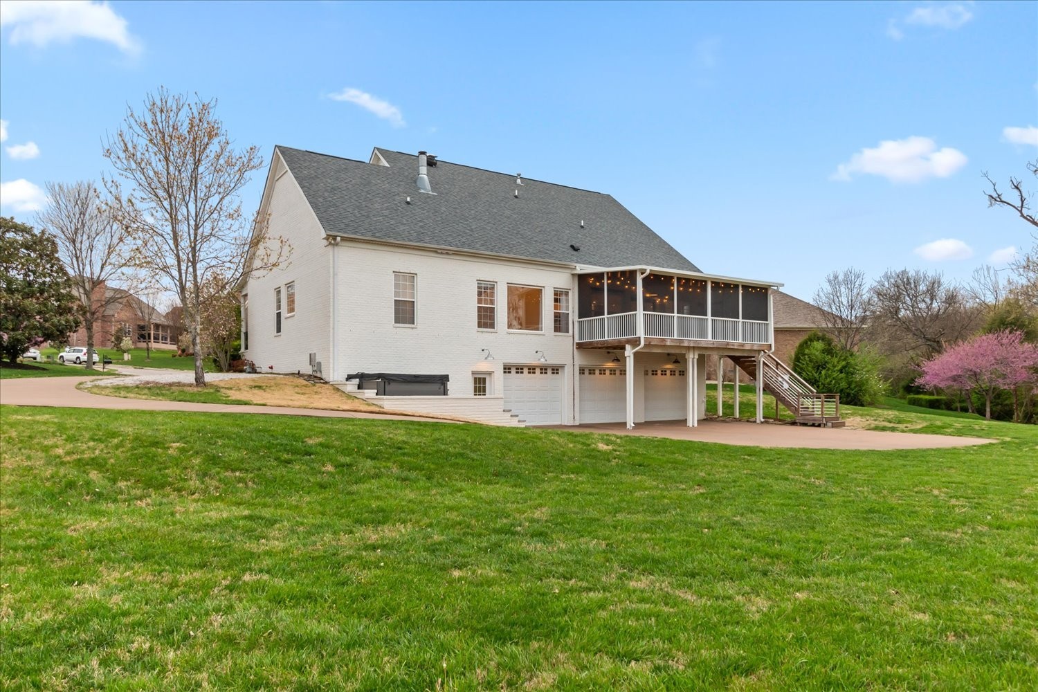 5004 Paint Creek Court Spring Hill, TN 37174 - Photo 65 of 91 a view of a house with a big yard and large trees