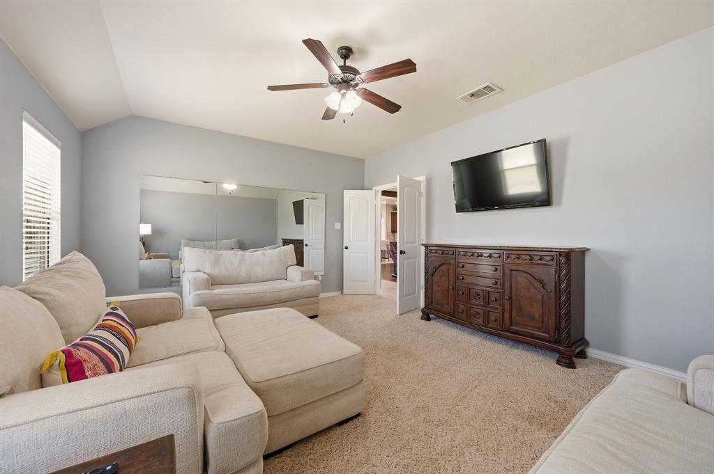 140 Heather Lane Decatur, TX 76234 - Photo 19 of 39 a living room with furniture and a flat screen tv