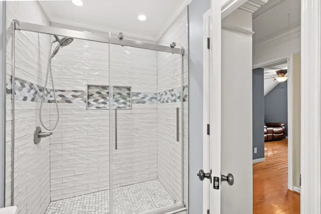 a bedroom with furniture and large windows