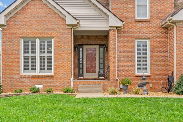 a room with furniture mirror on desk and chair