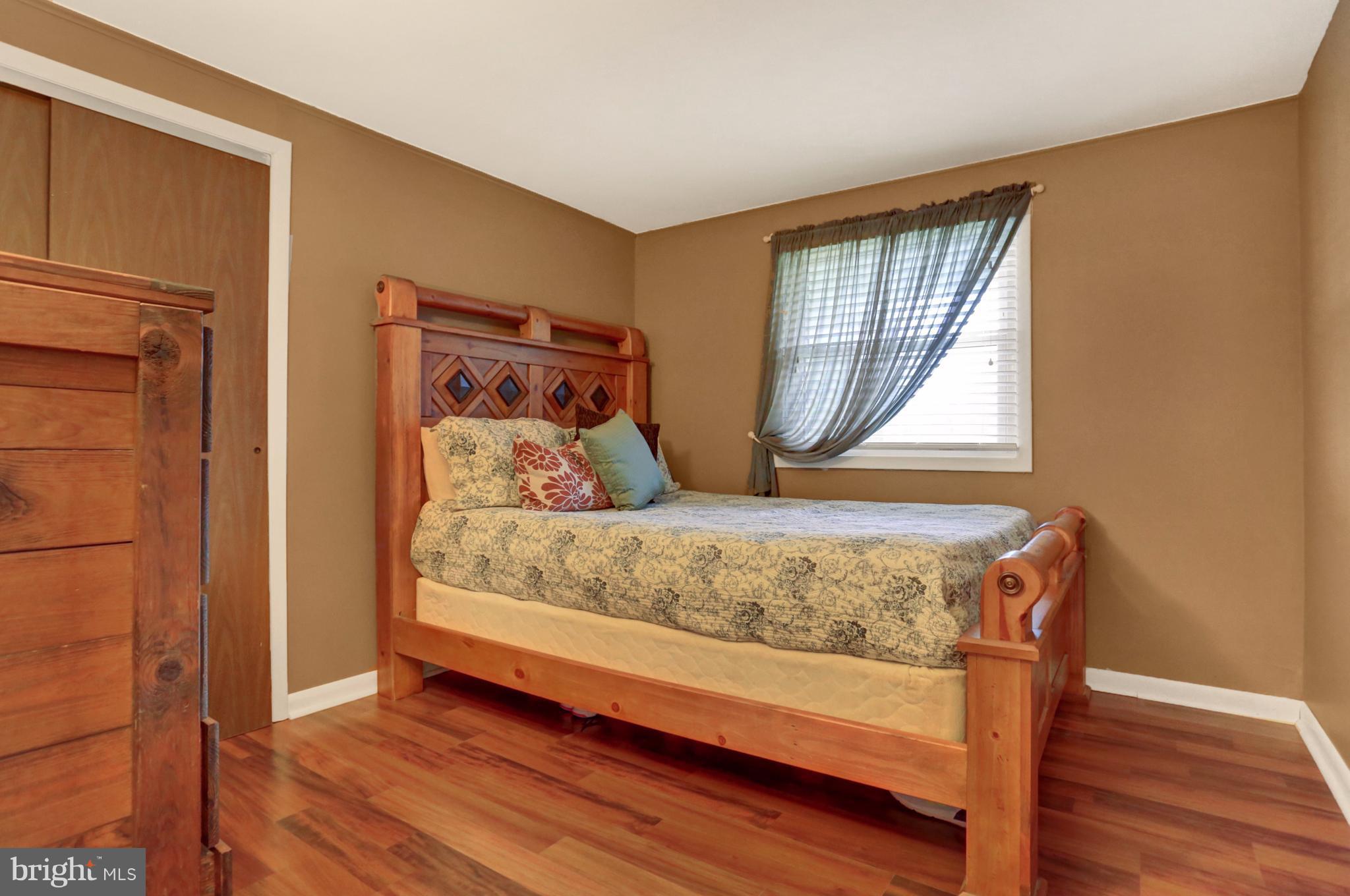 4629 Water Tank Road Manchester, MD 21102 - Photo 14 of 28 a bedroom with a bed and a window