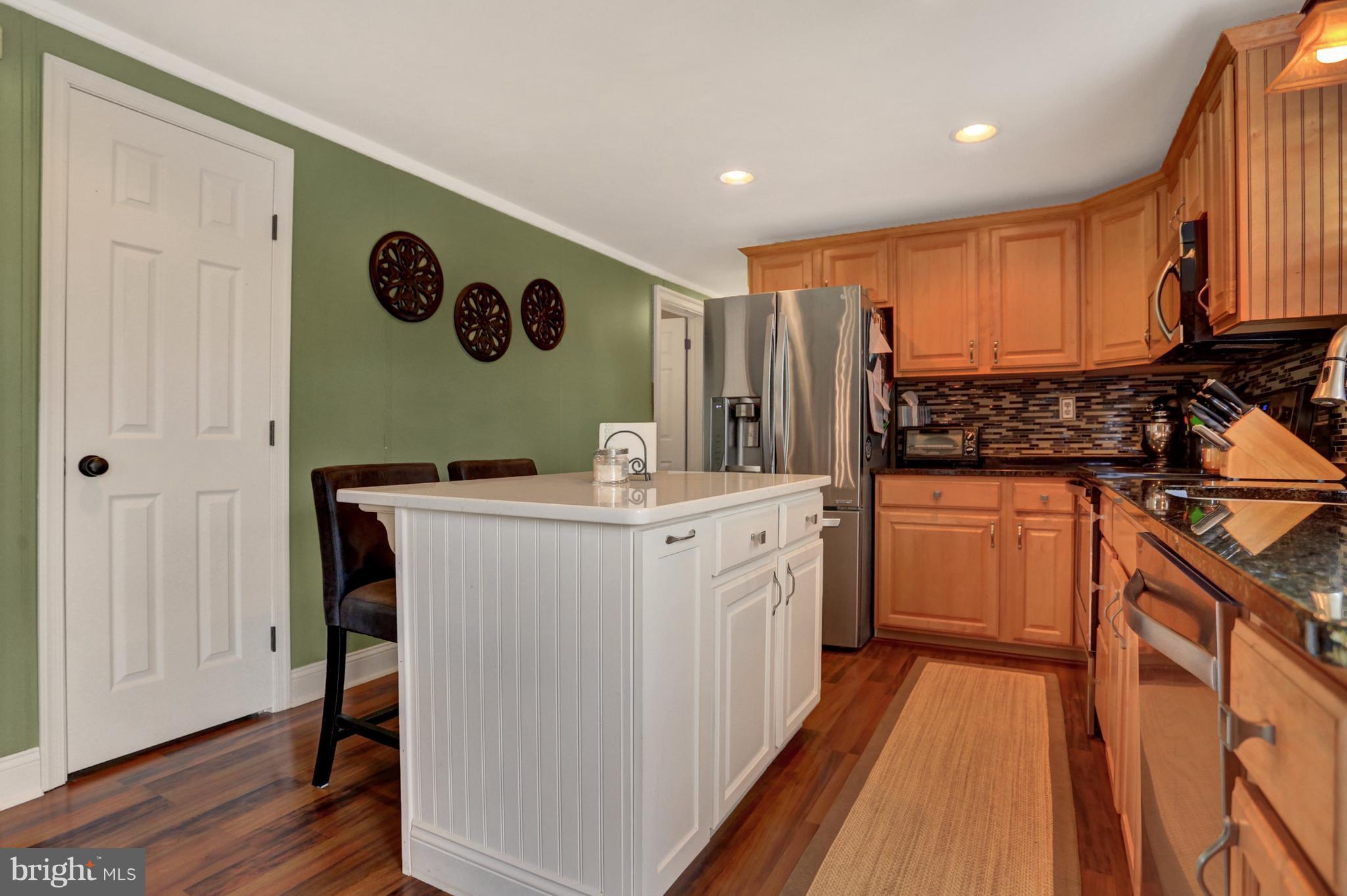 4629 Water Tank Road Manchester, MD 21102 - Photo 7 of 28 a kitchen with stainless steel appliances granite countertop a stove a sink and a refrigerator