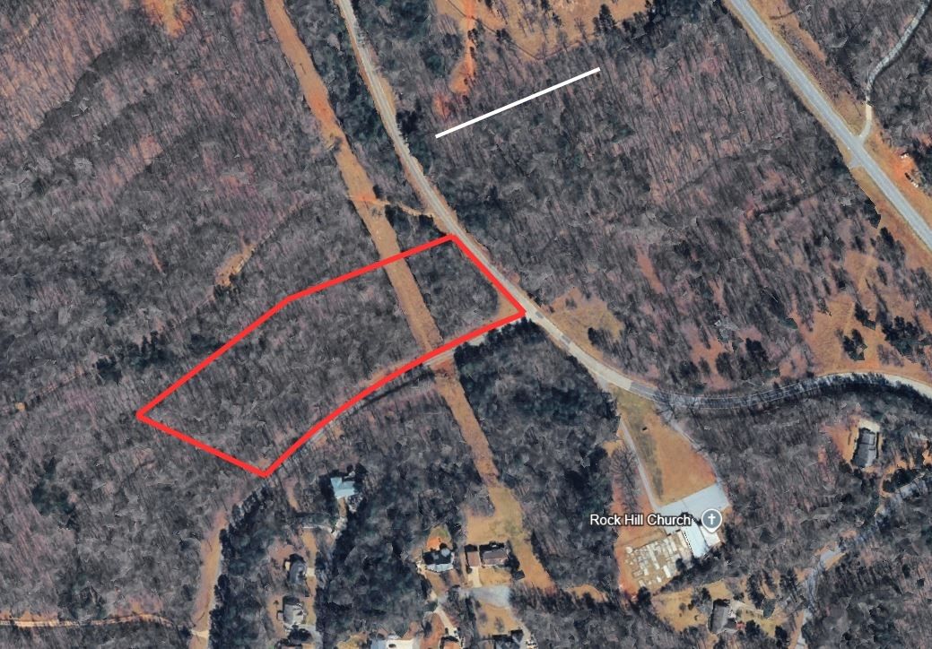 434 Rock Hill Road Fair Play, SC 29643 - Photo 2 of 11 A spacious lot offering ample room for a custom build, surrounded by lush woodlands.