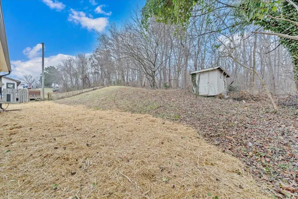 a view of a backyard of the house