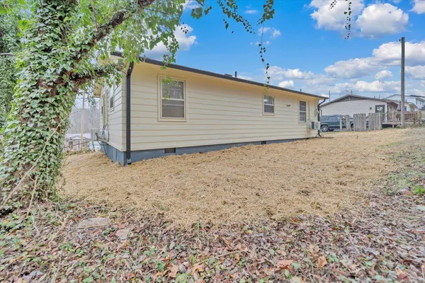 a backyard of a house with yard and garage