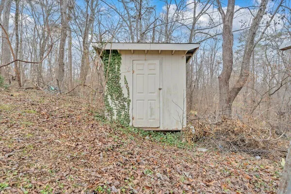a wooden door in front of a house