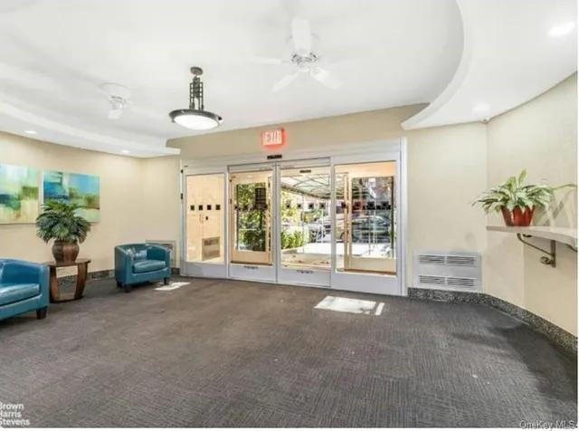 a room with furniture and a large window