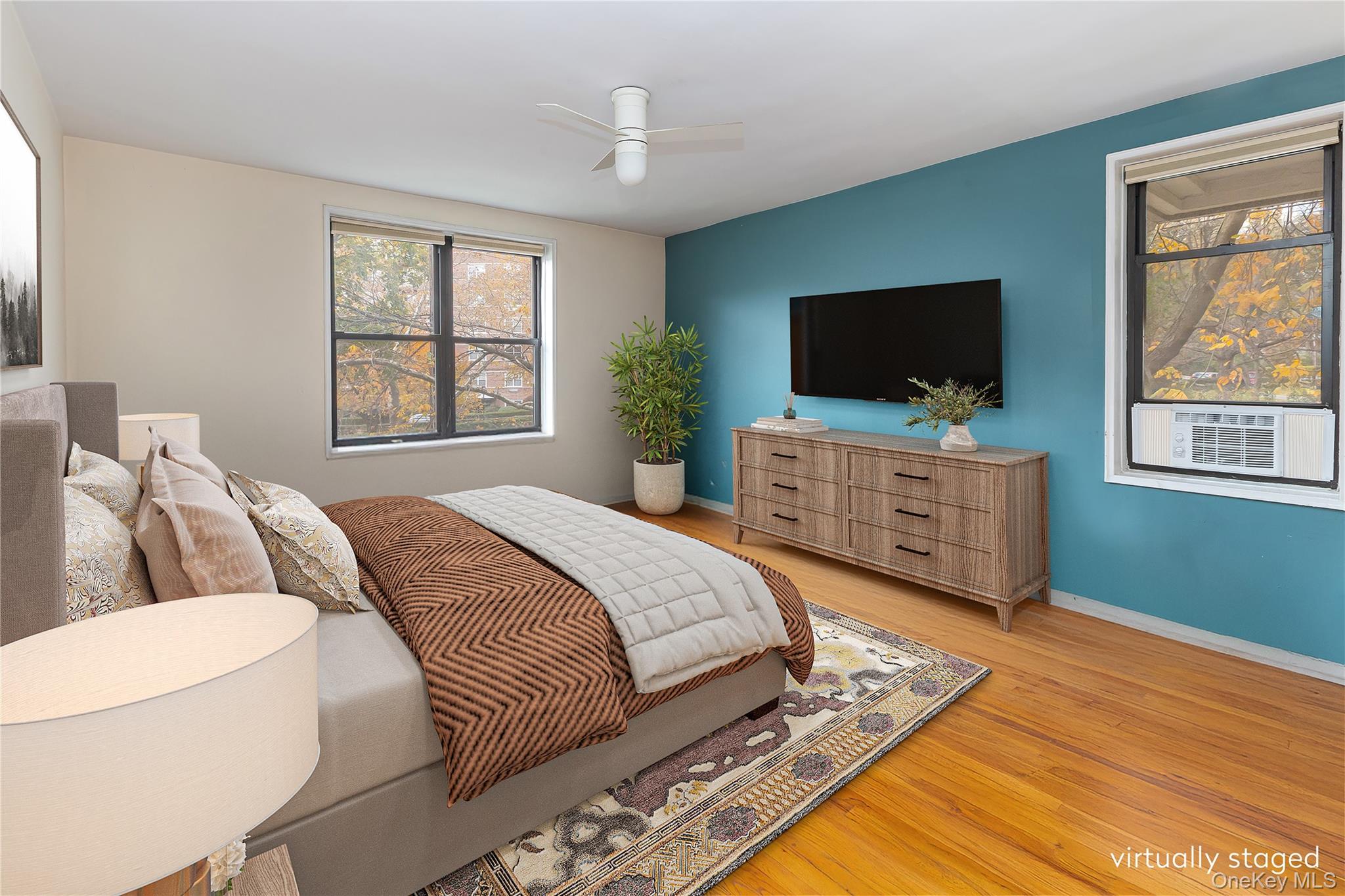 611 West 239th Street, Unit 3F Bronx, NY 10463 - Photo 5 of 12 a bedroom with a bed and a television