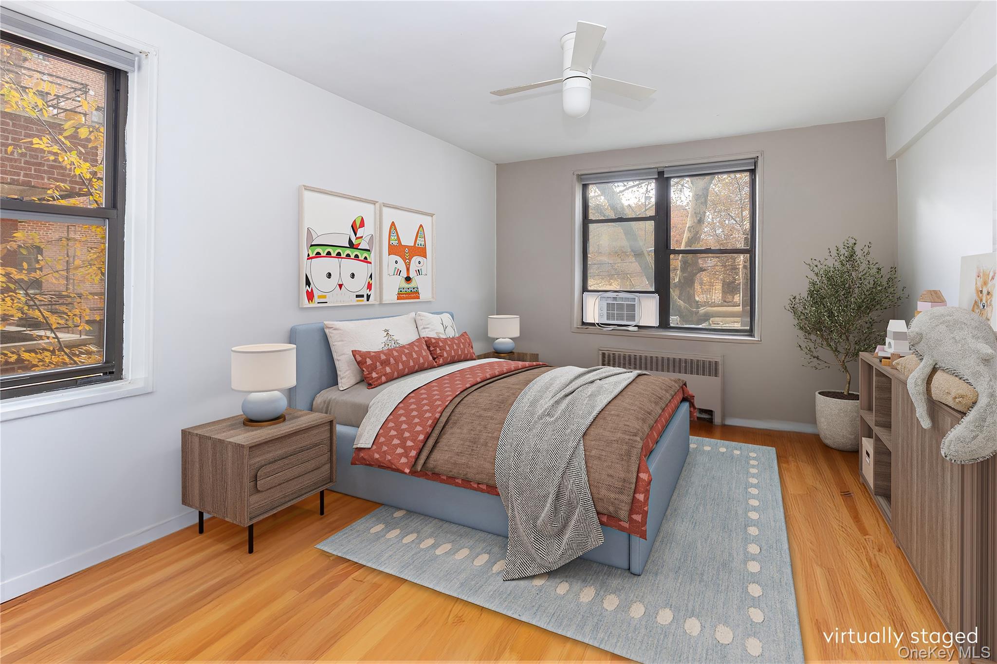 611 West 239th Street, Unit 3F Bronx, NY 10463 - Photo 6 of 12 a bedroom with a bed and wooden floor