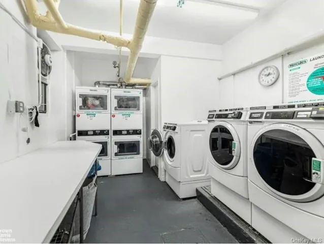 a utility room with sink dryer and washer
