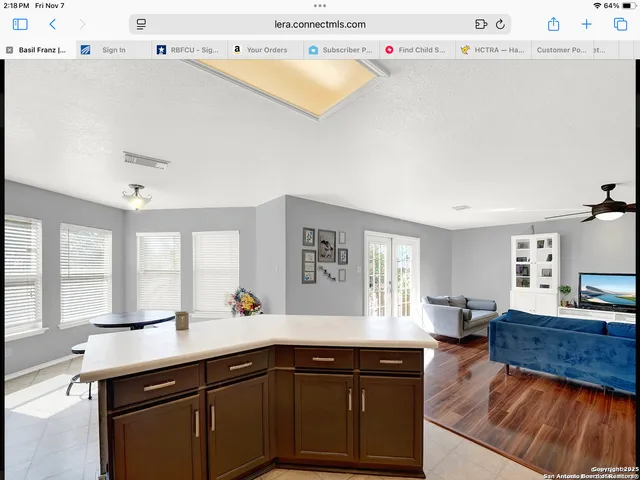a kitchen with a sink appliances and cabinets