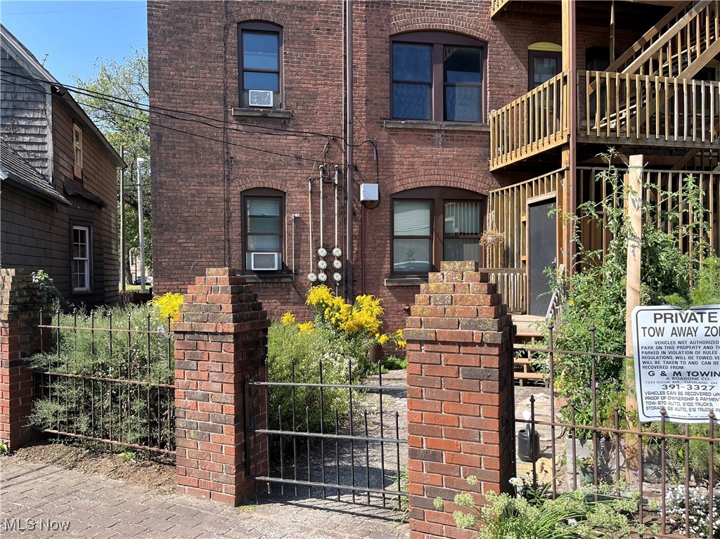 1905 Fulton Road, Unit 1B Cleveland, OH 44113 - Photo 16 of 22 View of rear courtyard area looking directly ahead at the exterior of the unit