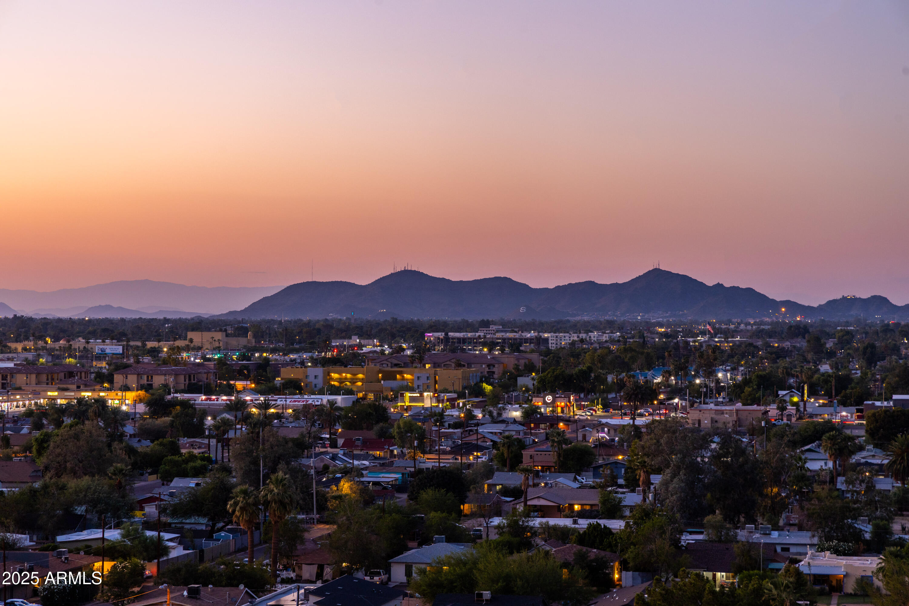 1040 East Osborn Road, Unit 904 Phoenix, AZ 85014 - Photo 21 of 22 a view of a city with mountains in the background