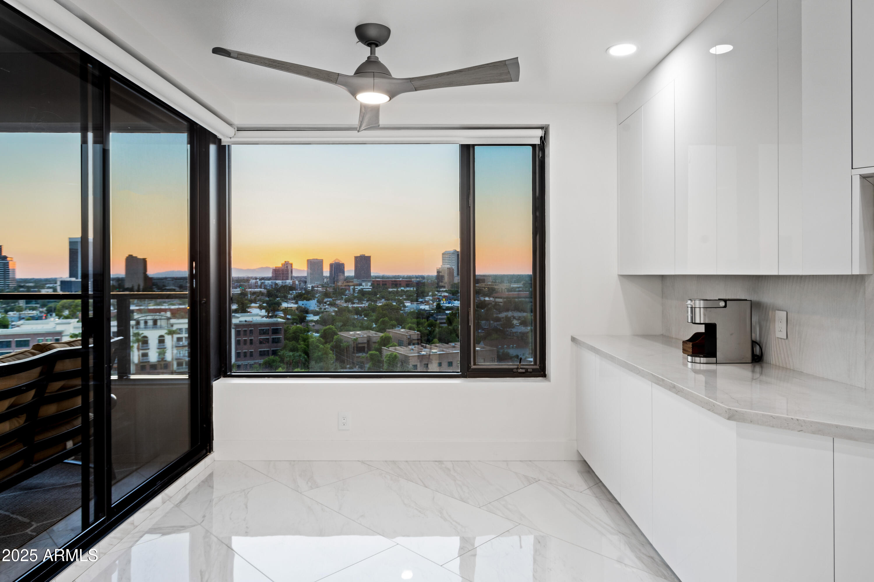 1040 East Osborn Road, Unit 904 Phoenix, AZ 85014 - Photo 9 of 22 a large white kitchen with a large window