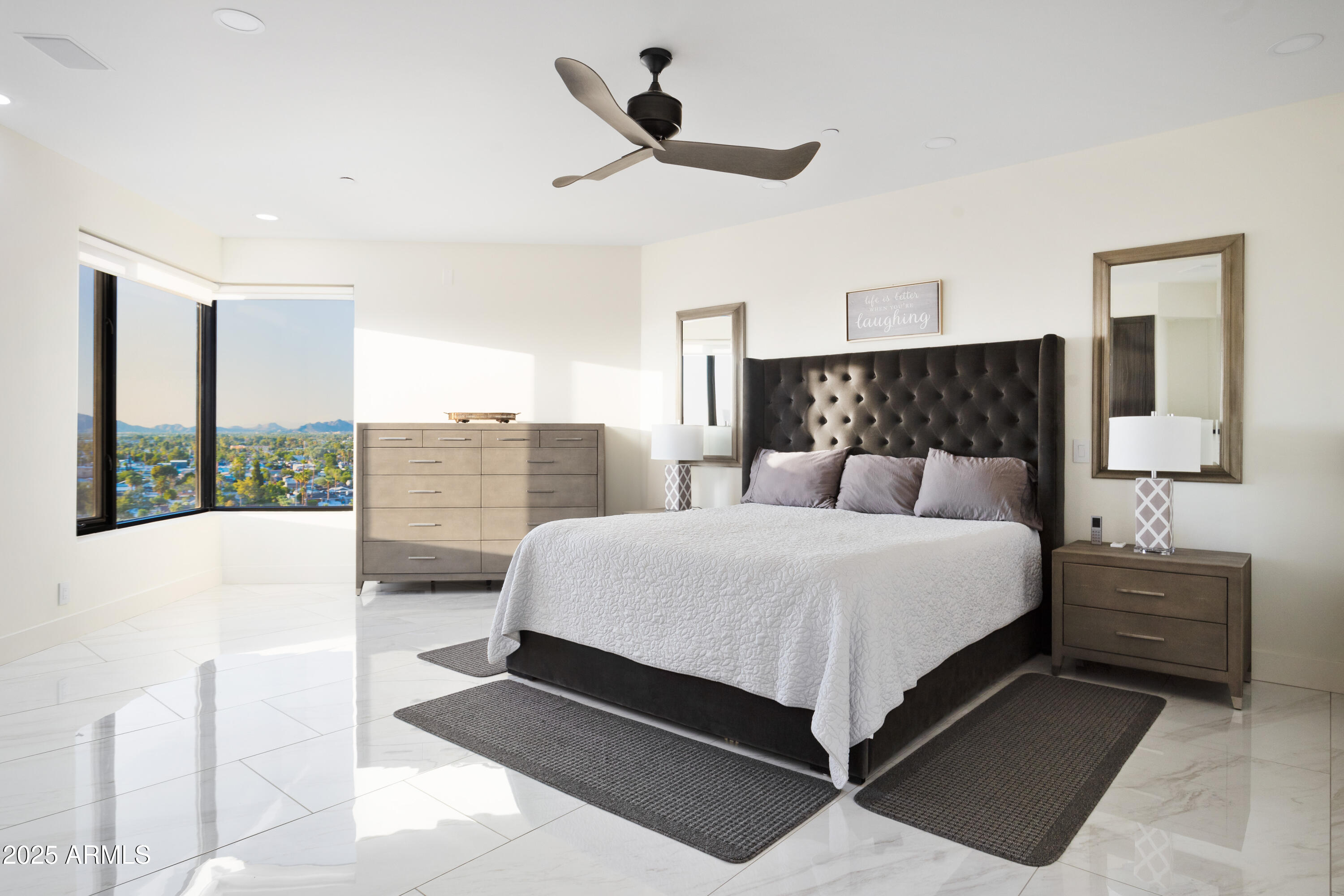 1040 East Osborn Road, Unit 904 Phoenix, AZ 85014 - Photo 10 of 22 a bedroom with a large bed and a window