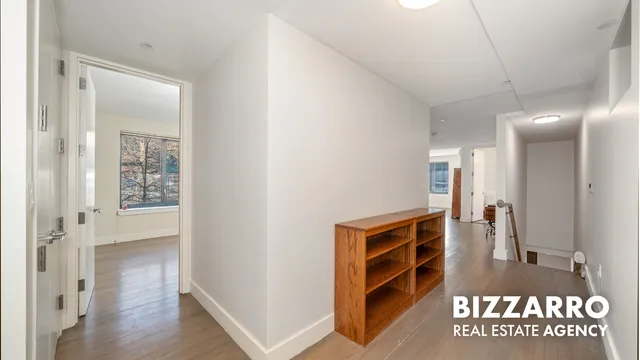 a view of front door with wooden floor