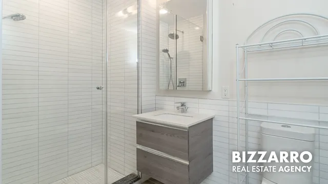 a bathroom with a sink a vanity and a mirror