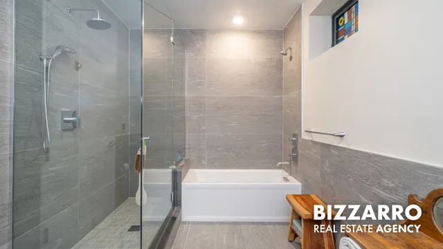 a bathroom with a bathtub and a shower