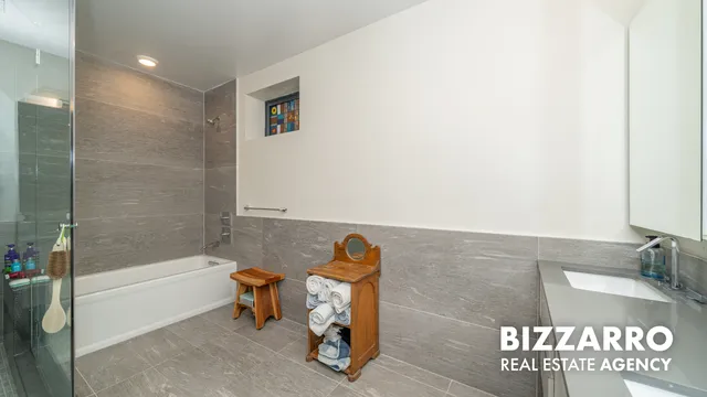 a bathroom with a bathtub and a shower