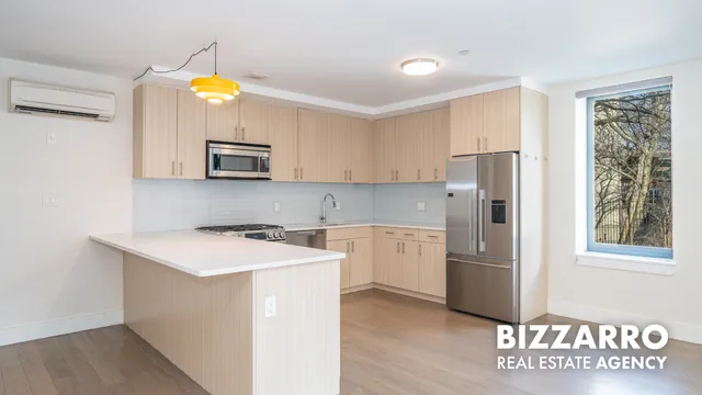 a kitchen with a sink and a stove top oven