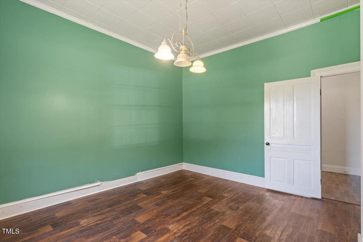 123 King Road Warrenton, NC 27589 - Photo 11 of 24 a view of a room with a fan and a refrigerator