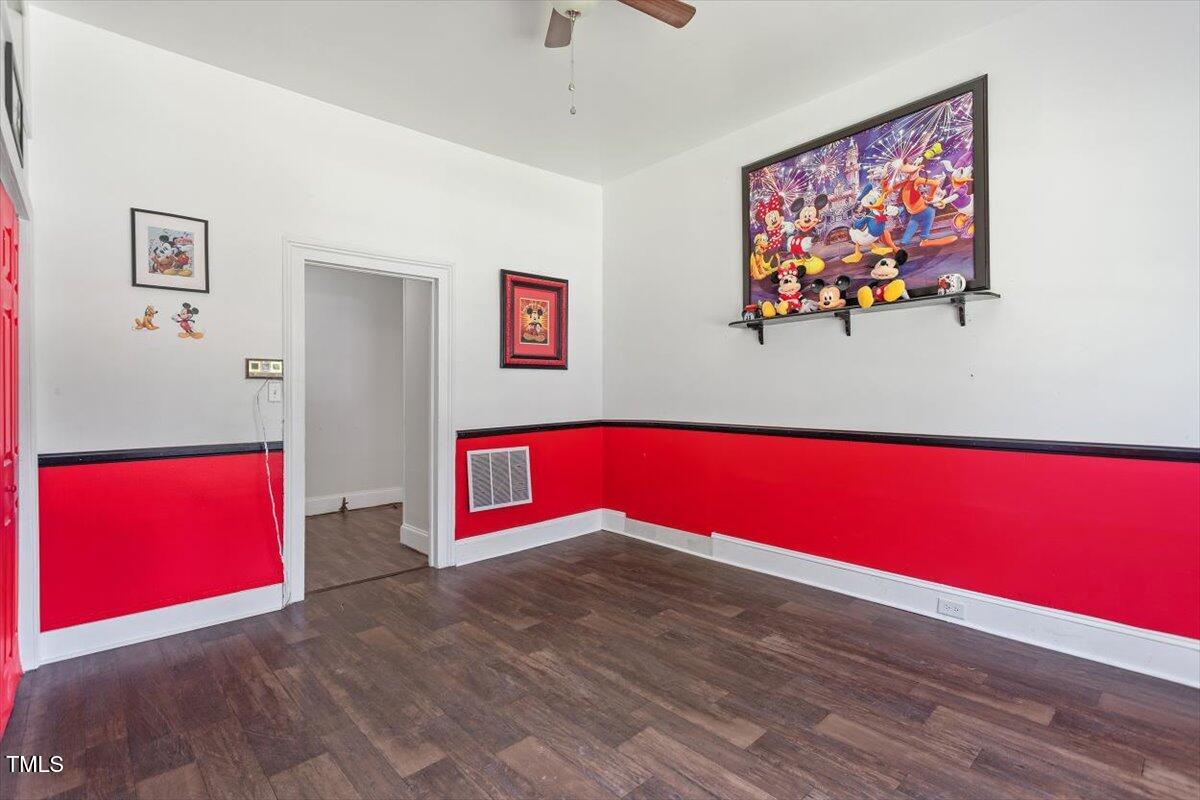 123 King Road Warrenton, NC 27589 - Photo 13 of 24 a view of empty room with wooden floor