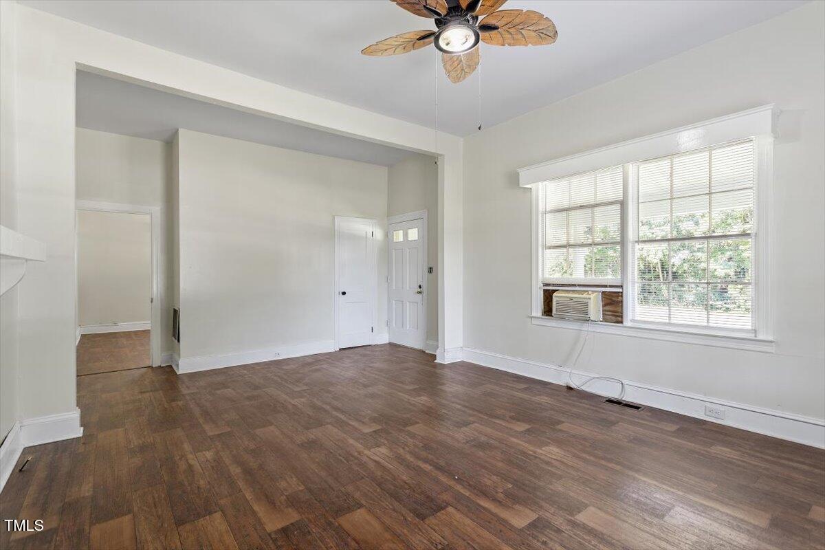 123 King Road Warrenton, NC 27589 - Photo 5 of 24 wooden floor in an empty room with a window