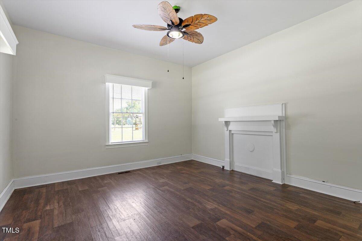 123 King Road Warrenton, NC 27589 - Photo 6 of 24 wooden floor in an empty room with a window