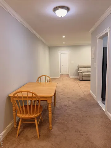 a bedroom with a bed and a chair