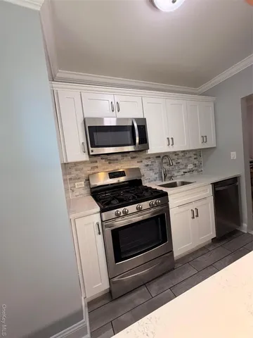 a kitchen with a stove and a microwave
