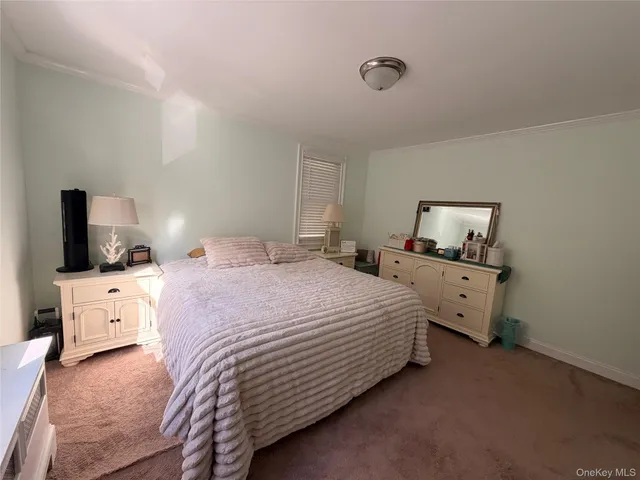 a bedroom with a bed and flat screen tv