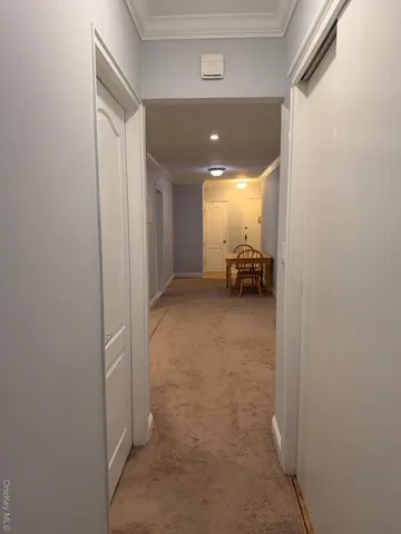 a view of hallway with livingroom