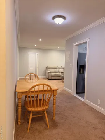 a kitchen with a table and chairs