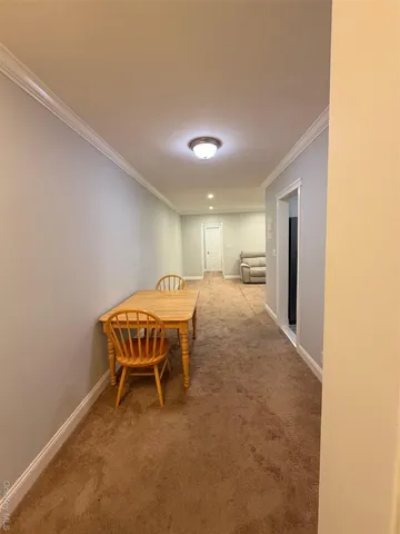 a bedroom with a bed and a chair