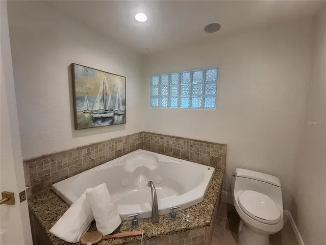 a white bath tub sitting in a bathroom