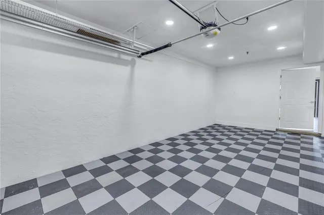 a bathroom with a black and white checkered floor