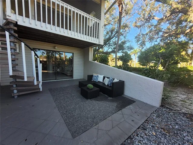 a view of a chairs and table in the patio