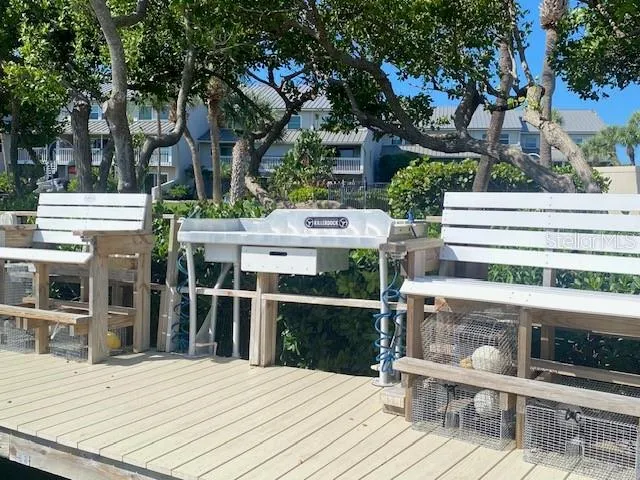 a view of a house with wooden deck