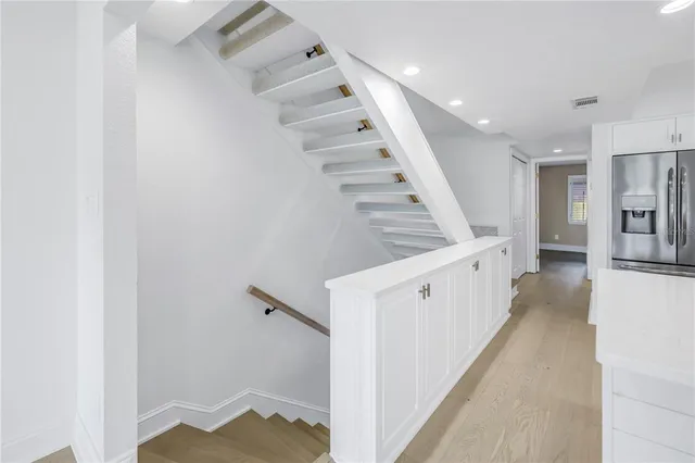 a view of a hallway with staircase