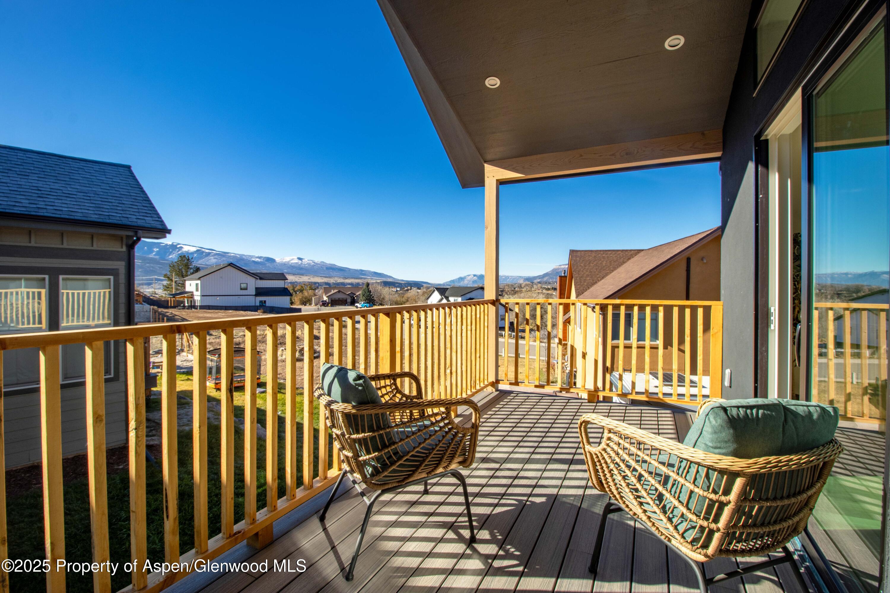 1411 Rifle Heights Drive Rifle, CO 81650 - Photo 13 of 31 a view of a chairs and table in the balcony