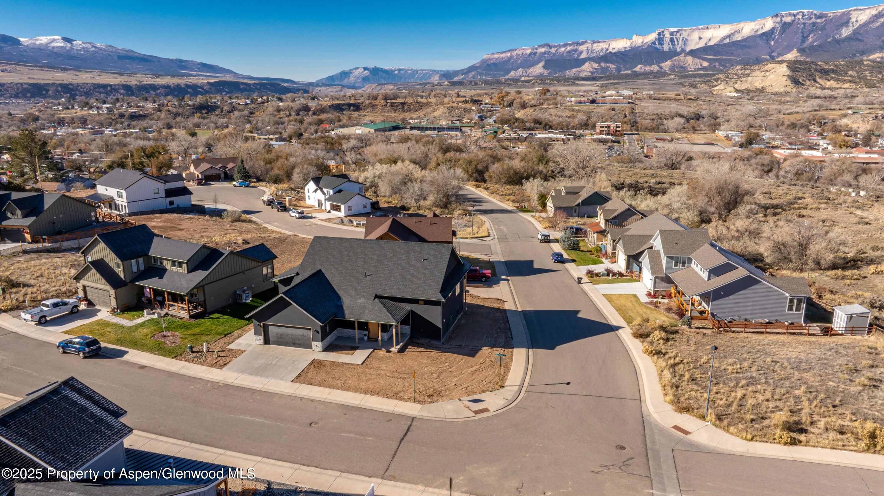 1411 Rifle Heights Drive Rifle, CO 81650 - Photo 28 of 31 an aerial view of a house with a mountain