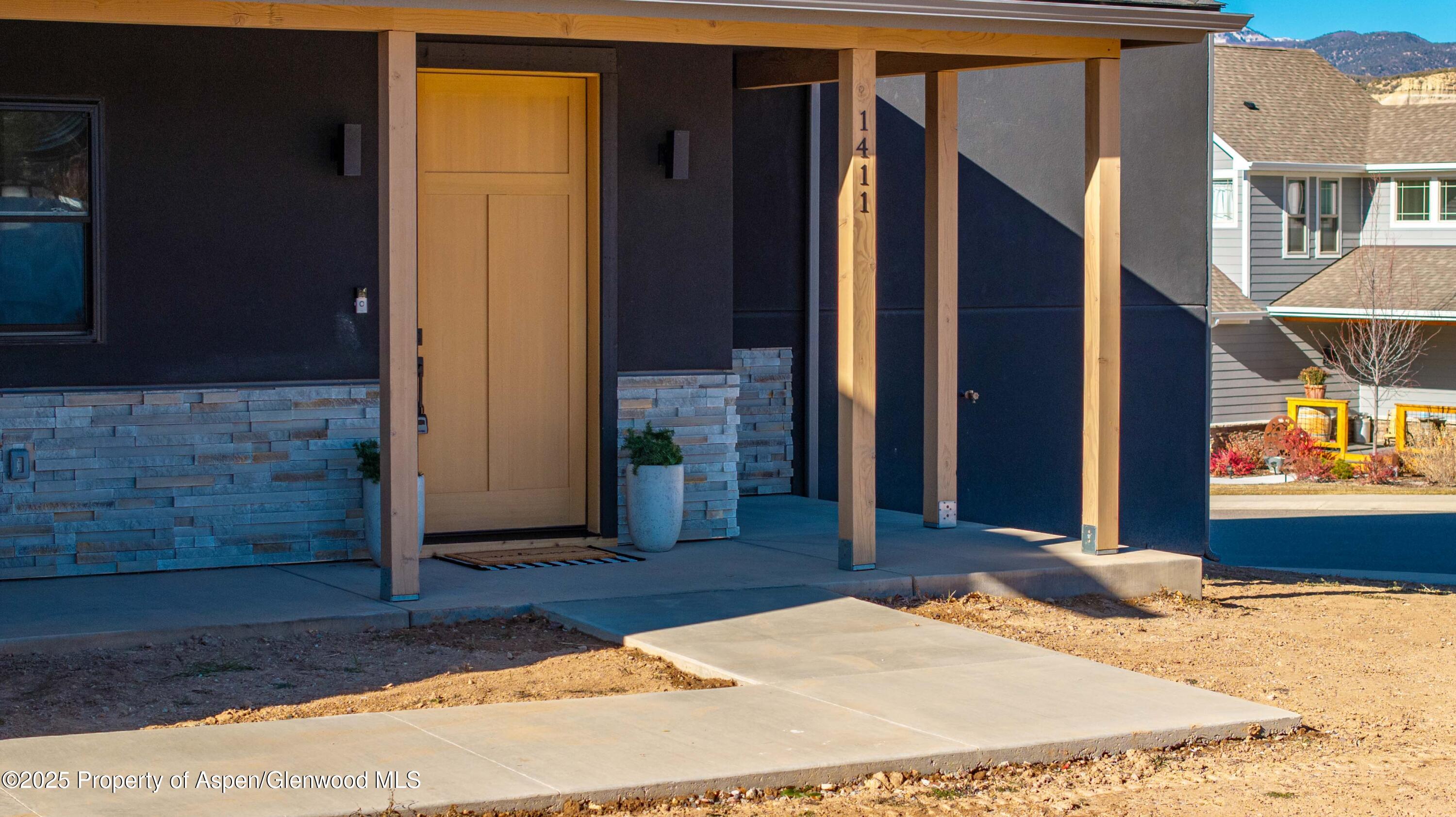 1411 Rifle Heights Drive Rifle, CO 81650 - Photo 30 of 31 a view of a entryway door of the house